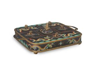 1388
A Chinese cloisonné smoking set
20th century
The enameled brass case with opposed handles, five compartments centering a lighter, and three ashtrays, all decorated with dragon figures and rolling sea motifs
4" H x 13.5" W x 10.75" D
Estimate: $300 - $500
