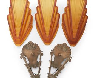 1451
A group of Art Deco sconces
20th century
Comprising three amber glass sconce shades and two Art Deco-style metal sconces, electrified
5 pieces
Each glass: 11.75" H x 6" W x 5.5" D; Each metal: 11" H x 5.5" W x 1.875" D
Estimate: $100 - $150