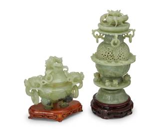 1390
Two Chinese carved hardstone censers
20th century
Each with dragon-form lid finial above ring accents and set on a wood stand, comprising one tiered with scrolled openwork above guardian lion figures, and another with opposed dragon-form handles and lion feet
2 pieces
Taller stone: 11.5" H x 5.75" Dia.; Shorter stone: 6.5" H x 8" W x 4.625" D
Estimate: $400 - $600