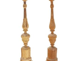 1376
A pair of carved wood altar sticks
Early 20th century
The carved wood candleholders, one side gilt and the other painted in a gold tone, each with columnar and foliate motif elements to the standard and raised on three paw feet
2 pieces
Each: 36.5" H x 9.5" Dia.
Estimate: $200 - $300