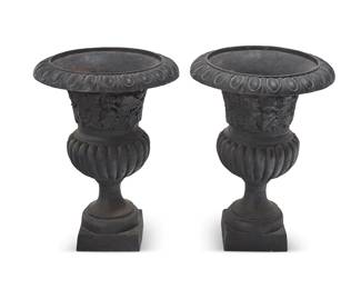 1370
A pair of Victorian cast iron jardinières
Late 19th/early 20th century
Each black painted planter with egg and dart rim above grape leaf motifs and a gadrooned body
2 pieces
Each: 29.5" H x 21.5" Dia.
Estimate: $400 - $600