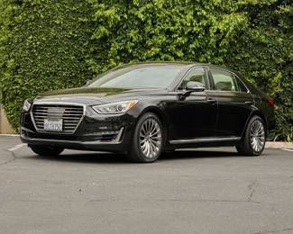 1494
A 2018 Genesis G90
VIN: KMHG54JH4JU044620; Plate: 8CTR752
Black exterior with cream leather interior
13,8XX miles
5.0 liter V8 engine
8-speed automatic transmission, rear wheel drive
Radio, CD player, MP3 jack, seatback screens, and navigation
Sunroof
Genesis manuals included
Estimate: $12,000 - $18,000