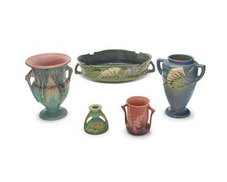 1436
A group of Roseville pottery items
Early/mid-20th century
Each marked for Roseville; each variously numbered: 467-10 / 424 / 851-3 / 102-5; one with inherently illegible marks and number
Comprising a 'Freesia' green handled low bowl, a 'Foxglove' vase, a 'Bittersweet' candleholder, a 'Moss' vase, and a 'Clematis' vase
5 pieces
Tallest: 8.5" H x 7.25" W x 6.25" D; Candle: 3.25" H x 3.375" Dia.; Bowl: 2.75" H x 12" W x 11.5" D
Estimate: $300 - $400