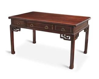 1399
A Chinese carved wood writing table
Early/mid-20th century
With three drawers to one side and three false drawers to the other, each squared leg with openwork at the juncture
30" H x 54.5" W x 33.25" D
Estimate: $200 - $400