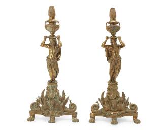 1377
A pair of Renaissance-style brass figural andirons
Late 19th century
Each depicting a partly robed figure of Hercules hoisting a flaming urn, raised on a shaped base featuring a pair of opposed dragons or gryphons centering a figural mask below a crest, raised on paw feet
2 pieces
Each: 40.5" H x 19" W x 26.5" D
Estimate: $200 - $300