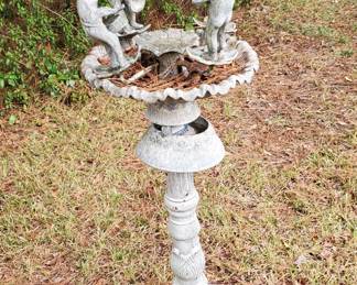 Metal birdbath frogs playing instruments 