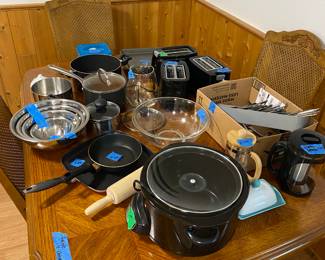 Kitchen appliances, cookware, dishes, table and chairs