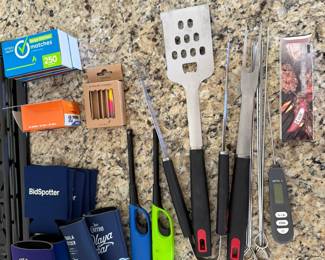 Grilling utensils, coozies, lighters, matches and meat thermometer 