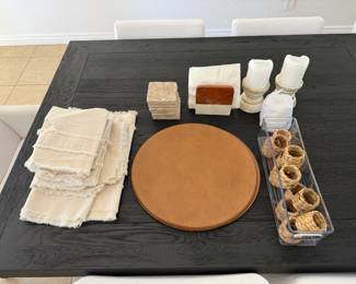 Leather placemats, linen napkins and table runner, candles and coasters