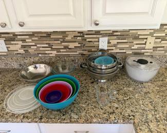 Mixing bowls (plastic, stainless steel), colanders/strainers and salad spinner