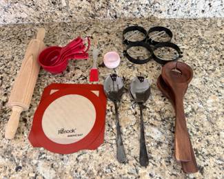 Cooking utensils: rolling pin, measuring cups, serving spoons and egg rings