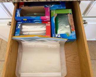 Plastic food storage bags along with silicone reusable bags