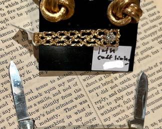 14k gold cuff links, tie clip with diamond, pocket pin knife. Removed daily. 