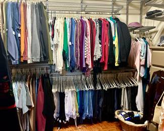 LARGE MASTER CLOSET FULL OF WOMEN'S AND MEN'S CLOTHES.