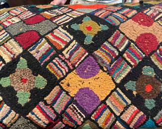 VIBRANT COLORS IN THIS HOOKED RUG.