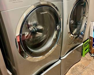 Electrolux washer and dryer with base.
