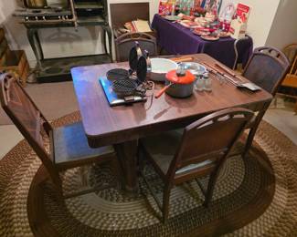 Antique art Deco dining room table with four chairs. 
