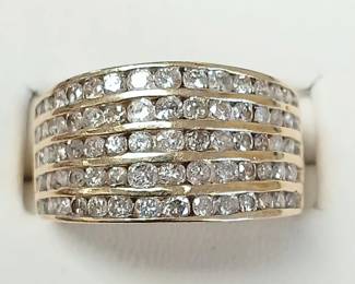 3 ct tw diamond band in 10k yellow gold. Approx sz 9