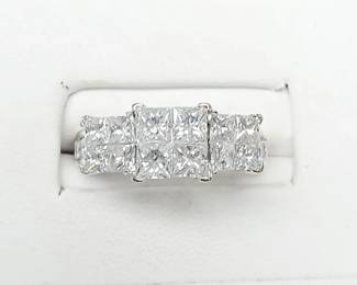 Invisible princess cut diamond ring with
2.20 ct tw in diamonds set in 14k white gold. Approx sz 4.25
This ring is a sparkler!!!