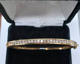 14k bangle with 0.50 ct tw in diamonds. Med wrist
