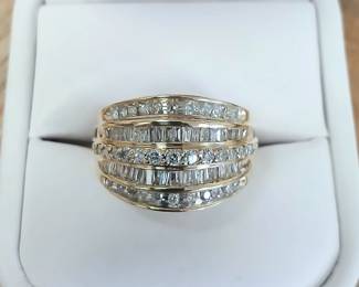 Baguette and round diamond band in yellow gold. Approx sz 6