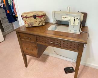 sewing machine in cabinet