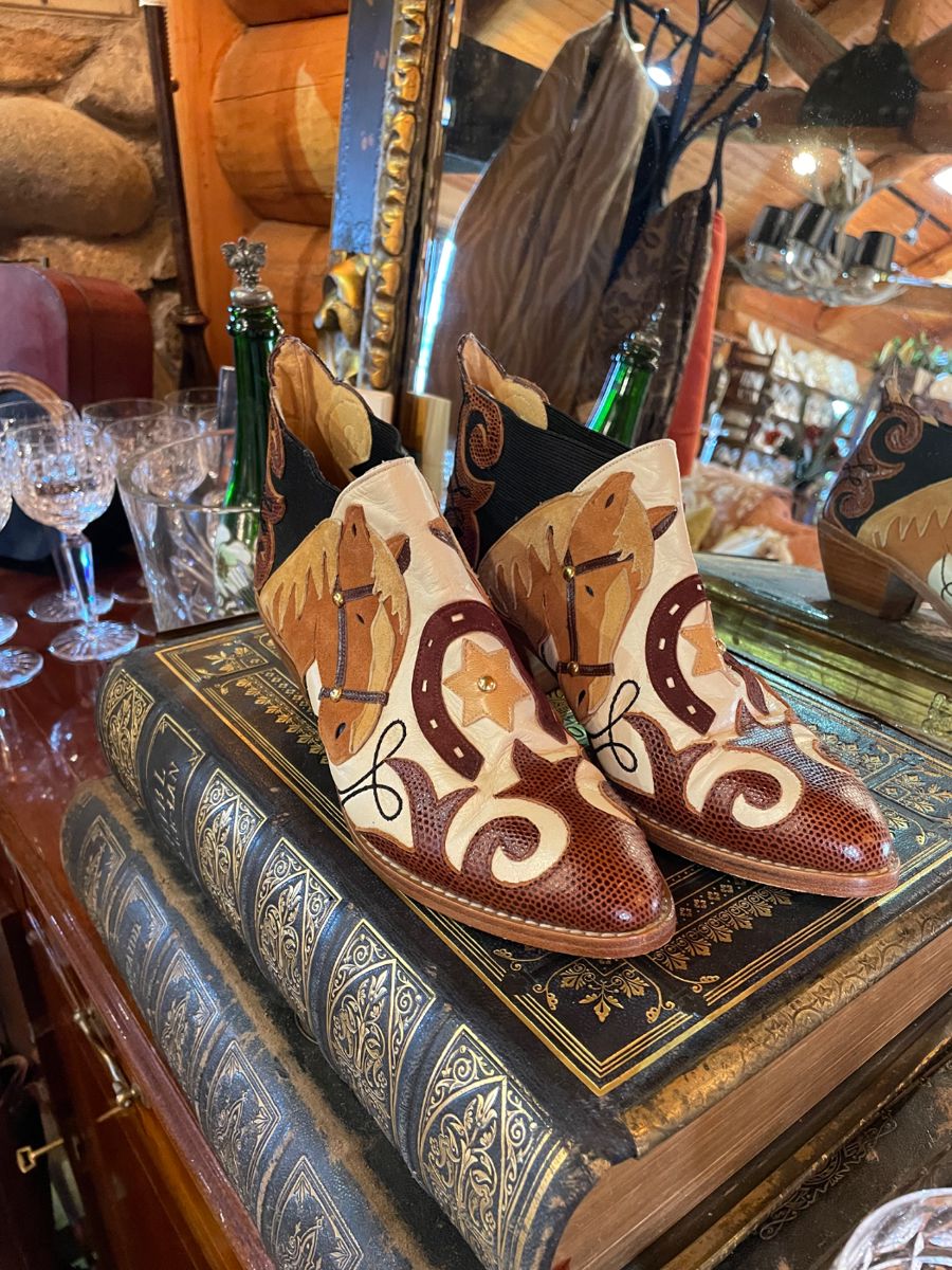 Lots of cool boots and underneath are 100+ year old Finnish Bibles!