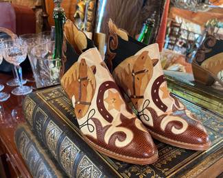 Lots of cool boots and underneath are 100+ year old Finnish Bibles!