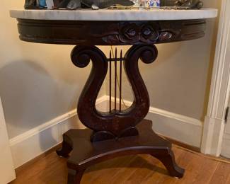 Victorian-style mahogany marble-top table with harp shaped base 