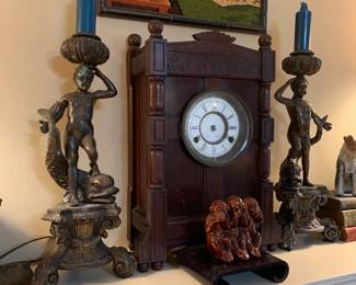 Pair of Bronze candlesticks featuring a boy with dragon fish 