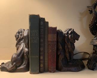 Brass lion bookends, antique books 