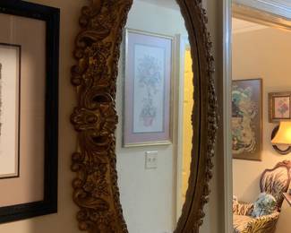 Oval gold framed mirror