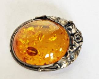 Silver and amber brooch