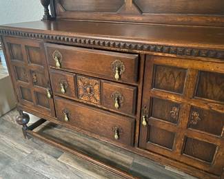 Dimensions:    63”x23”x55.5”
Antique Sideboard/Buffet with stunning hardware and hand tooled ornate details.  Drawers and doors function well.  
