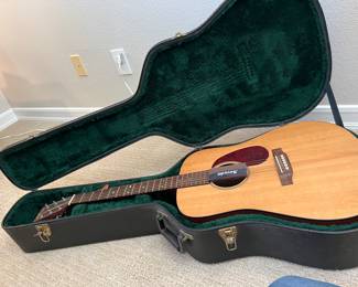 Martin dreadnought guitar in a hard case - like new