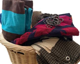 Basket Full Of Beach Towels, Bathroom Mats, A Shower Curtain With Hooks 