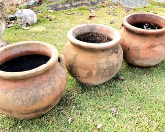 several outdoor planters both terra cotta & concrete