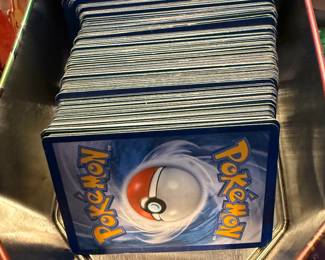 Pokemon cards (approx 180) with tin