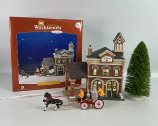 Christmas village house with tree and figurines