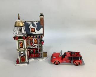 Christmas village house with fire truck figurine