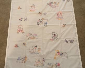 This pristine handmade sheet has a patching baby side pillow and embroidered case as well