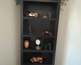 Solid wood book shelf.
Office decorations:
Old fashioned wood cars and more 