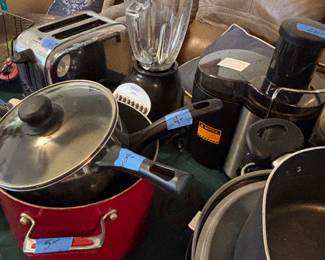  Small kitchen appliances, pots and pans. 