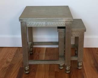 Pair of stackable tables with decorated tin over wood
