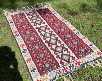 Beautiful woven rug, approximately 4' by 6'