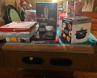 New in box items on pool table