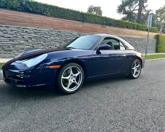 2nd owner/Only 5K miles on new engine which replaced under original warranty and as a preventative measure/Lapis Blue Metallic /Graphite Gray Leather Interior/