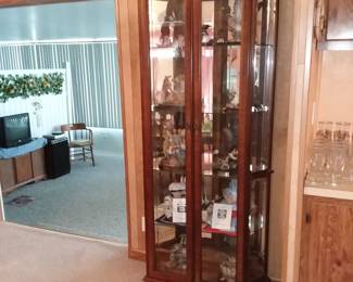 Curio cabinet with collectibles 