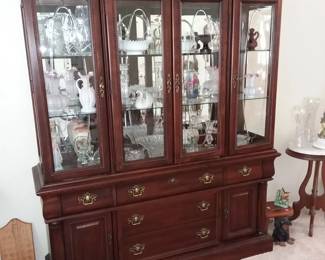 Hutch filled with treasures including Fenton 