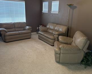 3 pc Greige Leather set consisting of 2 loveseats and chair in Media Room